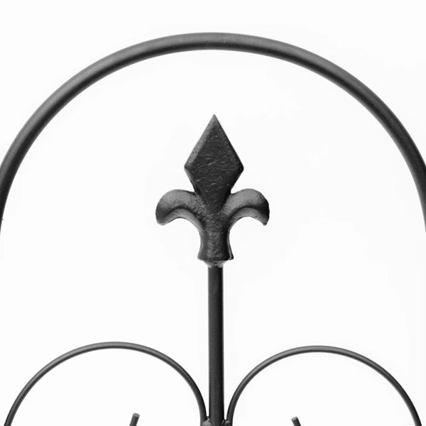 Black metal fence top finial with fleur-de-lis spear detail on a rounded rail