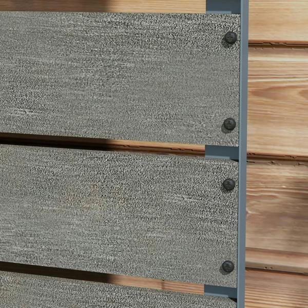 Close-up of dark grey planter box panel with corner screws and visible textured surface