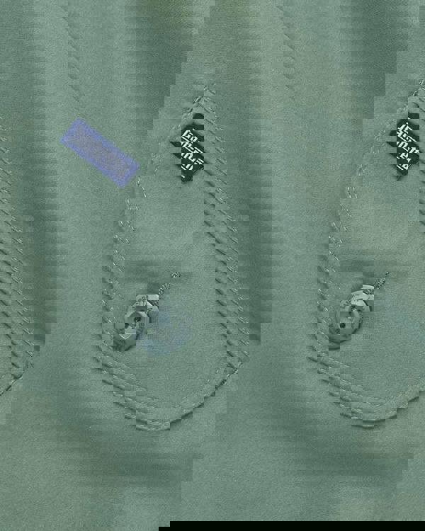 Lambretta Mens ShowerProof Classic Harrington MOD Scooter Jacket Coat, close-up of the jacket's pocket with Lambretta branded button and label.