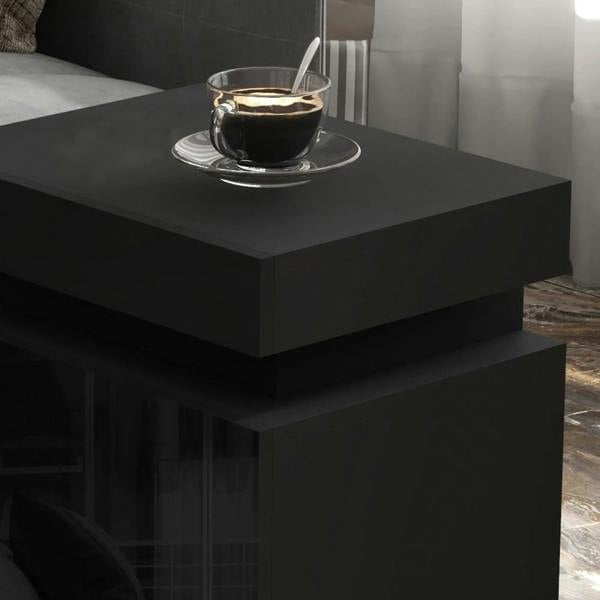 Black high-gloss LED bedside table top with coffee cup on surface and under-light
