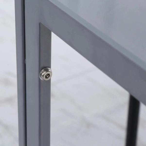 Close-up of grey metal dining table leg corner with mounting hardware
