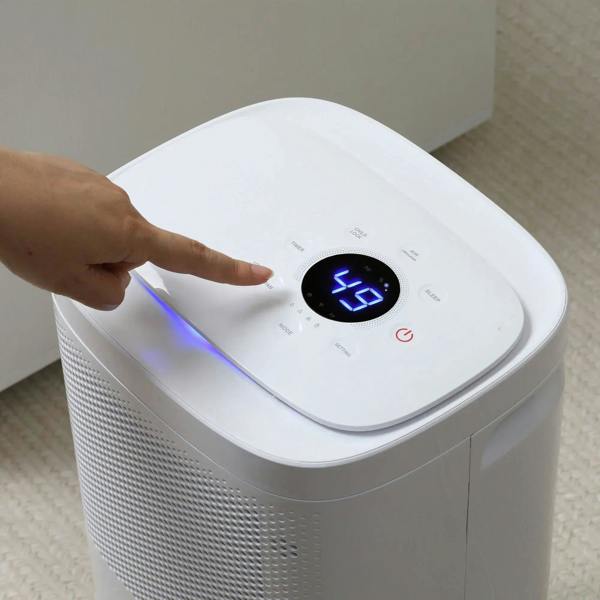 White dehumidifier top control panel with digital display and blue light