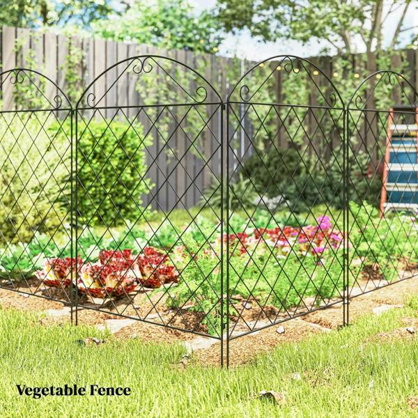 Black diamond-mesh metal fence panels with arched tops around flower and vegetable beds