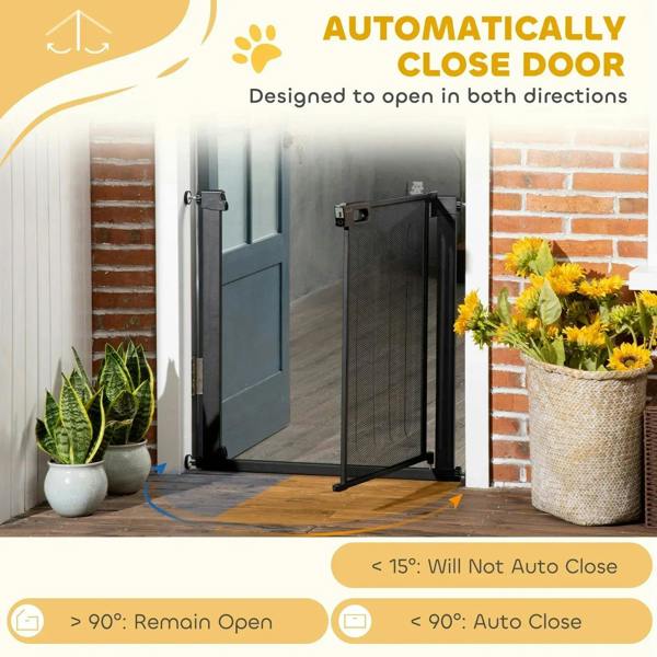 Black dog safety gate positioned on doorway with automatic close door feature