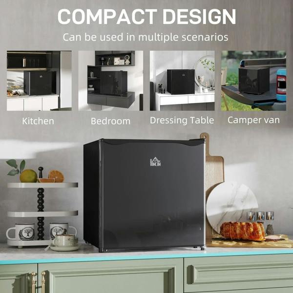 Compact black mini fridge on floor with door closed in a room setting
