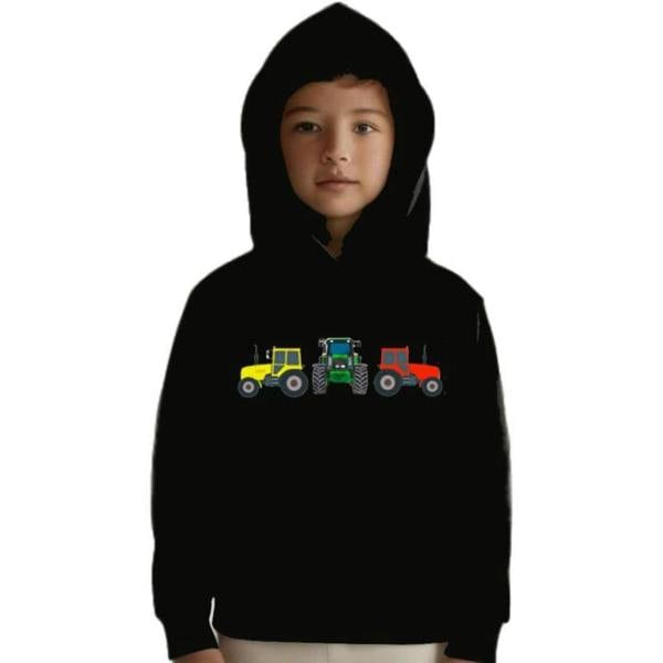 Young boy wearing Kids Three Tractor Hoodie outdoors, warm, comfortable fit for chilly play days