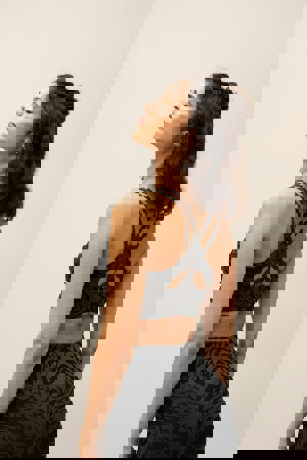 Black grey charcoal recycled seamless marble print low to medium impact supportive sports bra for yoga, pilates, spinning, weights, running and exercise.