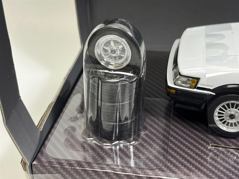 a toy car in a plastic case