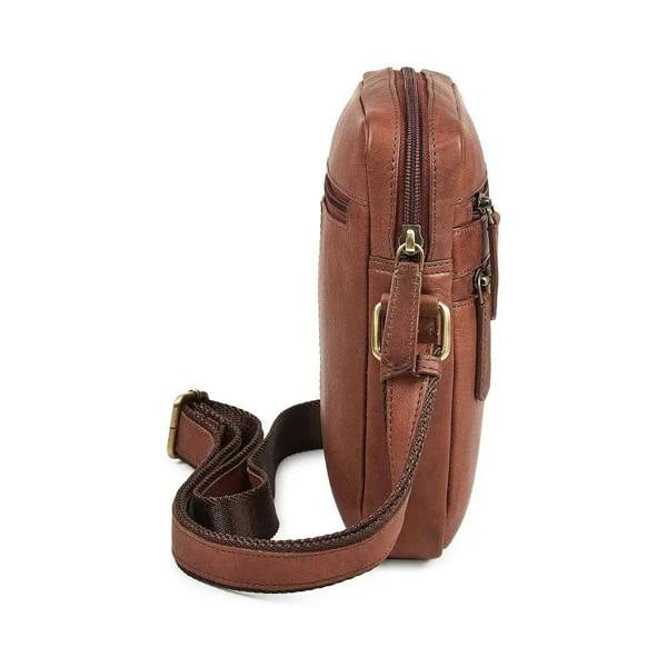 Brown leather crossbody bag with gold zippers on a white background