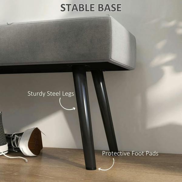 Grey upholstered bench leg close-up with sturdy steel legs and protective foot pads