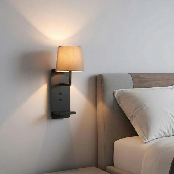 black reading wall light for bedroom installed on a wall in a modern bedroom next to the bed. 