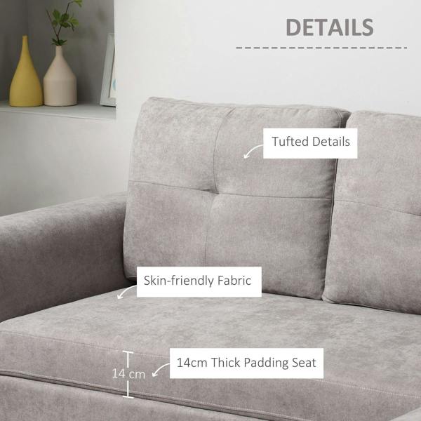 Light grey sofa bed arm and seat with tufted upholstery and thick padding