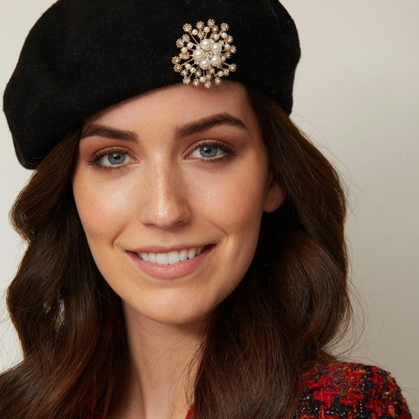 vintage hat with pearl brooch worn with hair down