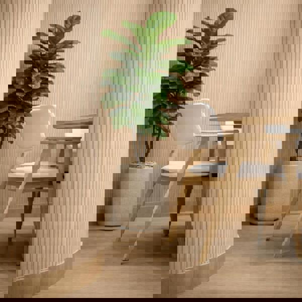 Modern interior with a potted plant and wooden chair against wooden wall paneled wall