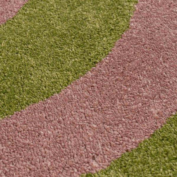 Close-up of a carpet with green and brown stripes
