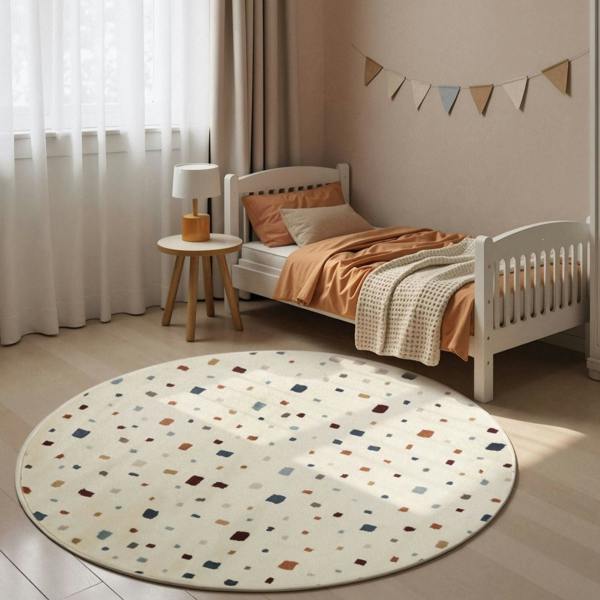 Children's bedroom with a polka dot rug, bed, and side table.