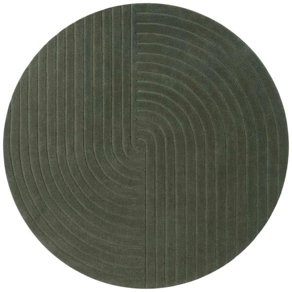 Round green rug with a textured pattern on a white background