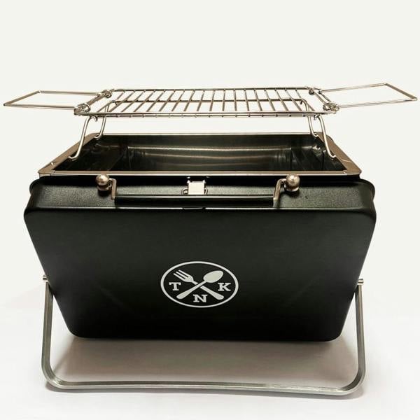Front view of the Portable Notebook BBQ unfolded with the grill rack attached.