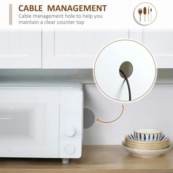 White freestanding kitchen cabinet countertop with cable management hole near the drawer