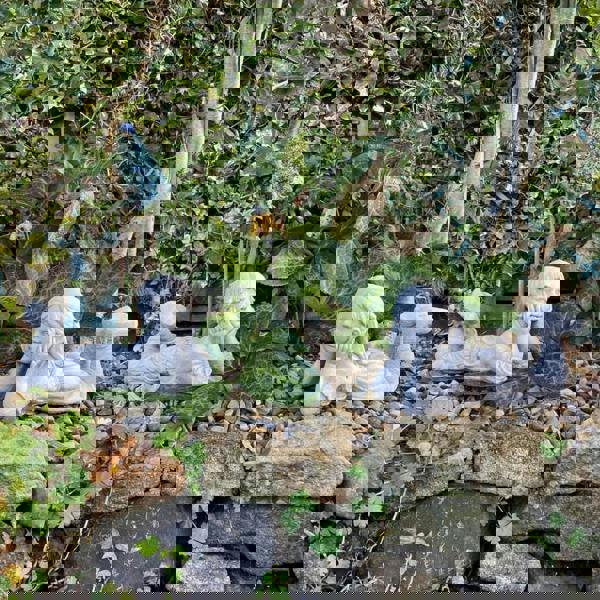 Cheerful Laying Boy and Girl Outdoor Ornament