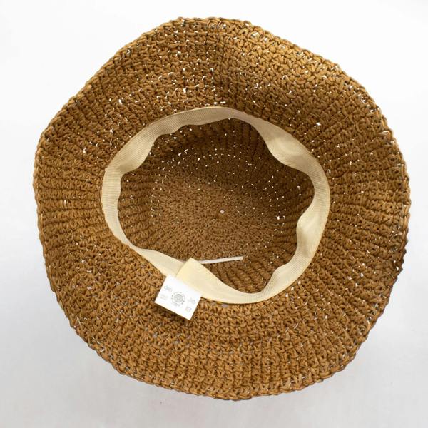 Tan straw floppy sun hat underside with cream fabric band and small label