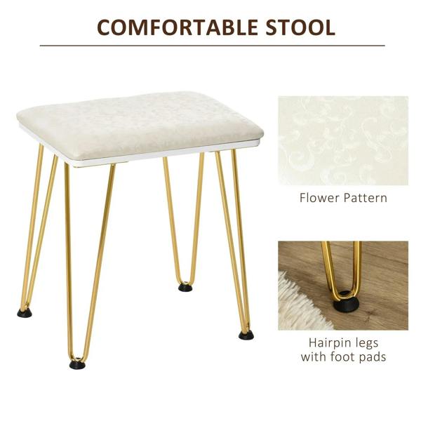 Cushioned stool with light fabric top and gold hairpin legs with foot pads