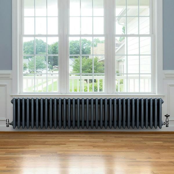 Traditional anthracite 4 column radiator, 300 x 1505mm, featuring a sleek design and smooth finish, positioned under a large window