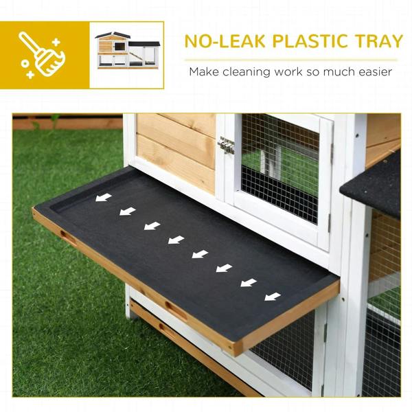 Wooden rabbit hutch ramp and lower tray area with black surface and wire-mesh side panels