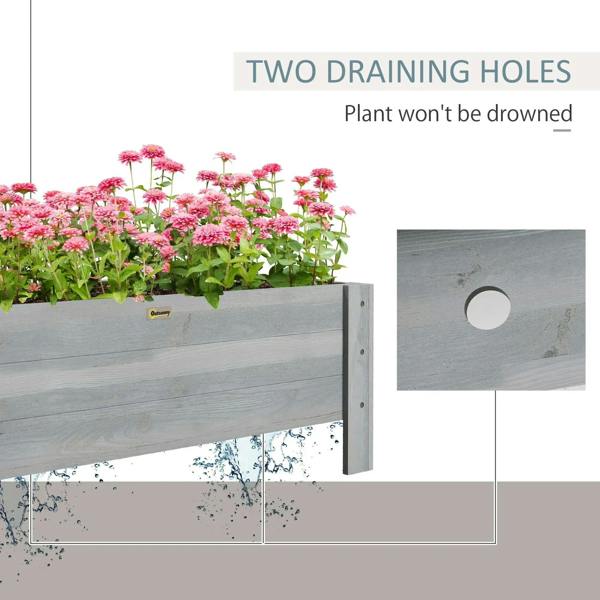 Grey raised garden bed planter with visible drainage holes