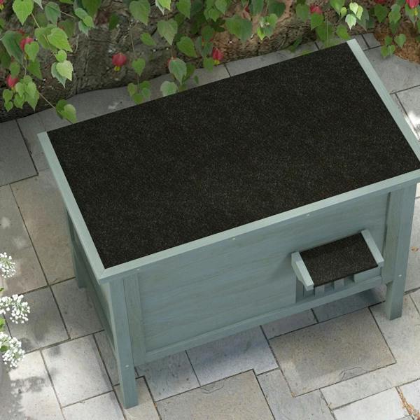 Charcoal gray insulated wooden cat house with open front and dark interior floor mat