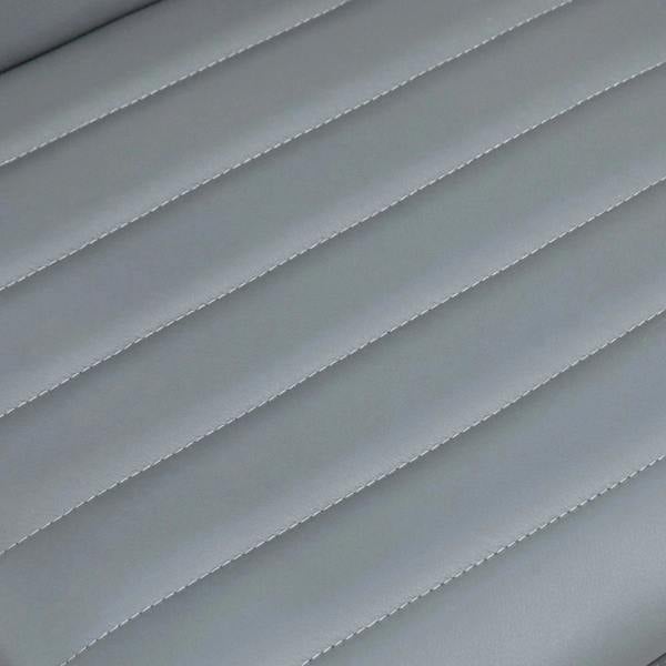 Light grey padded faux leather seat with stitched horizontal seams detail