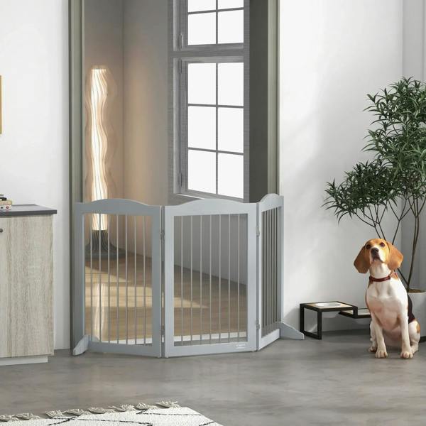 Grey freestanding pet gate with tall vertical bars and hinged side panels