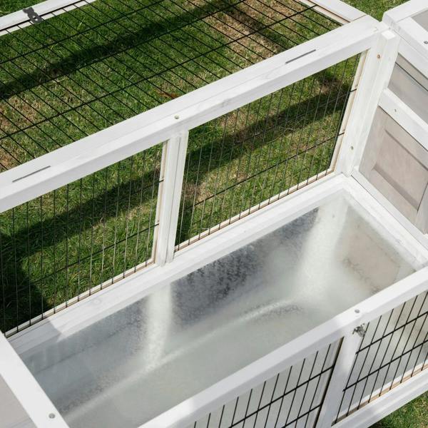 Grey rabbit hutch and run with removable tray, close-up of wire mesh and inner tray