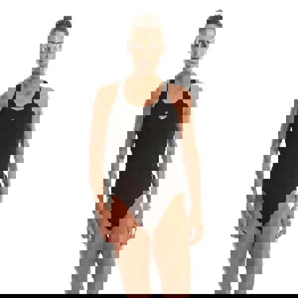 Black Speedo Endurance+ Medalist swimsuit with gold trim and chlorine resistant fabric