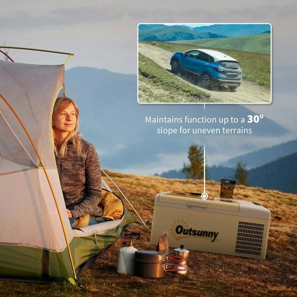 Khaki and grey portable car fridge near an outdoor tent with open camping setup