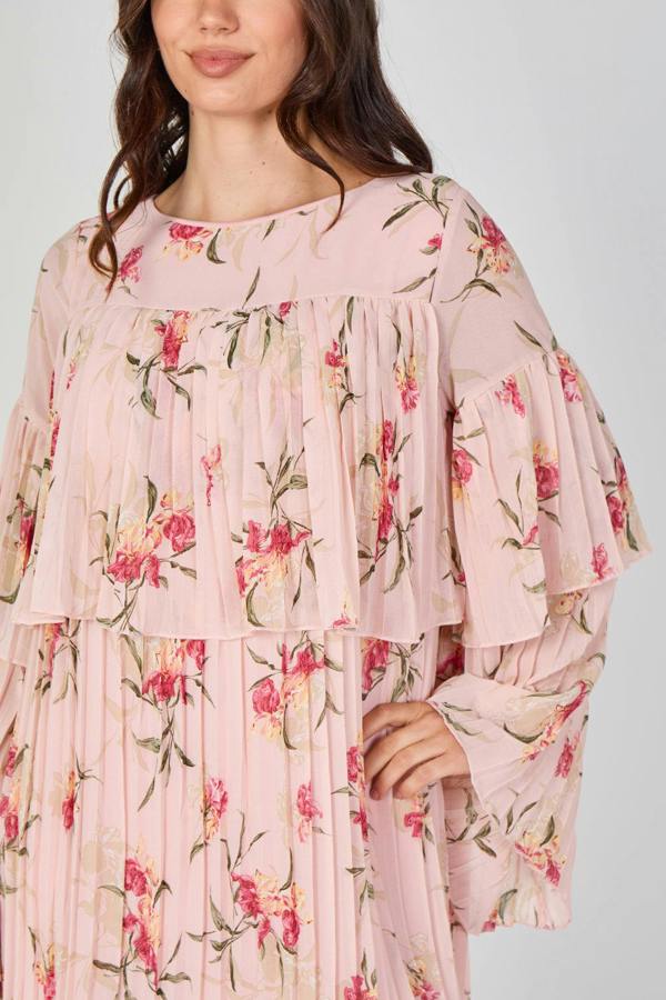Pink floral dress worn by a model on a white background