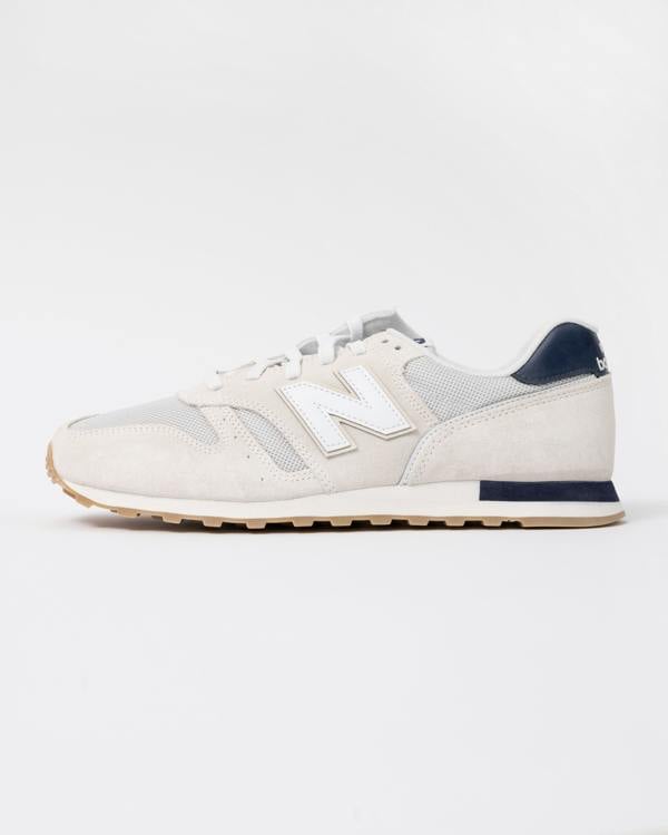 side of New Balance 373 Mens Trainers in Sea Salt