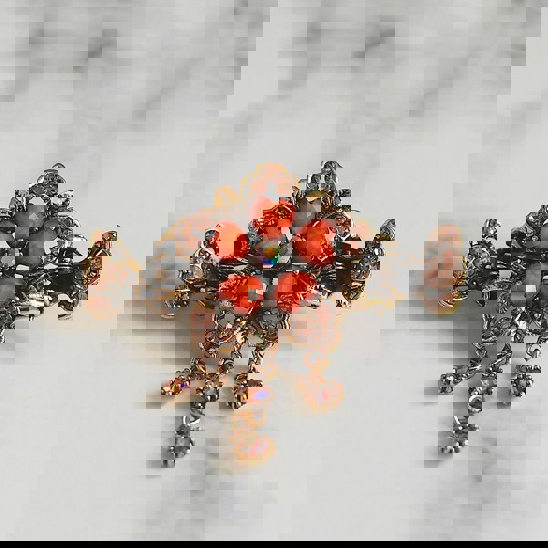 flower hair accessory in gold with crystal