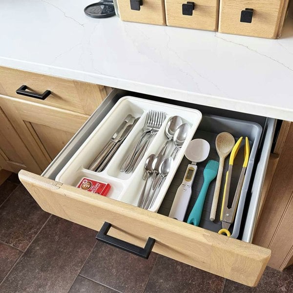 Extendable Drawer Organiser OLPRO - inside a kitchen drawer with cutlery