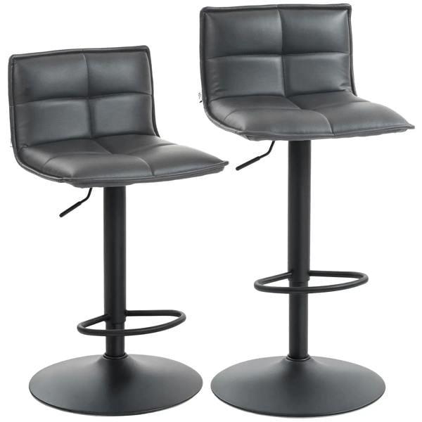 Set of two dark grey faux leather bar stools with tufted backrests, curved seats, and round footrests