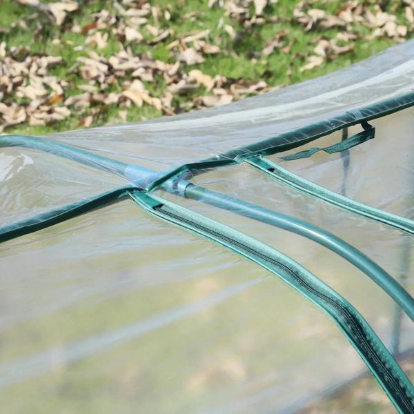Clear greenhouse cover corner with zip seam and teal arched steel support poles