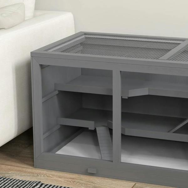 Grey wooden hamster cage with mesh top and multi-level interior compartments