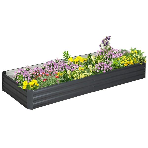 Grey metal raised garden bed planter box with decorative flowers on top
