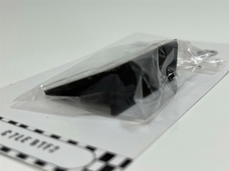 a plastic bag with a black object in it