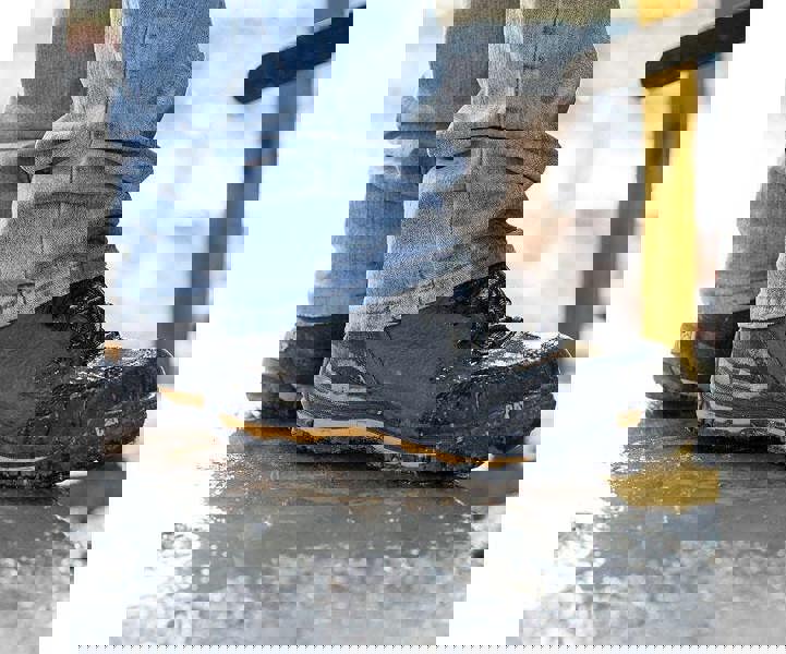 Caterpillar Munising Mens Composite Toe/Midsole S3 Water-Resistant Safety Boots, waterproof work boots on wet ground, safety footwear for construction and industrial work.