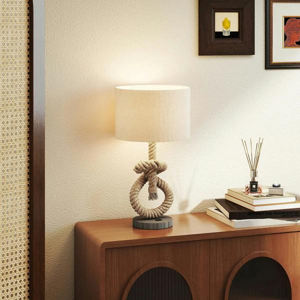 Hemp rope table lamp with cream shade on wooden console table, wall backdrop