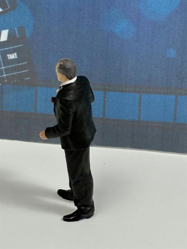 a toy figure of a man in a suit