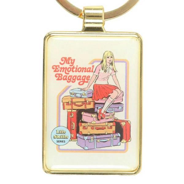 Gold keychain charm close-up with 'My Emotional Baggage' illustration.