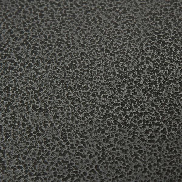 Black textured metal surface detail of the bird perch stand tray