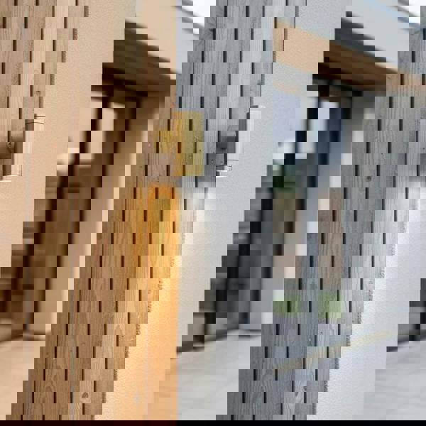 exterior brass wall light mounted on a wooden wall of a modern home outside 